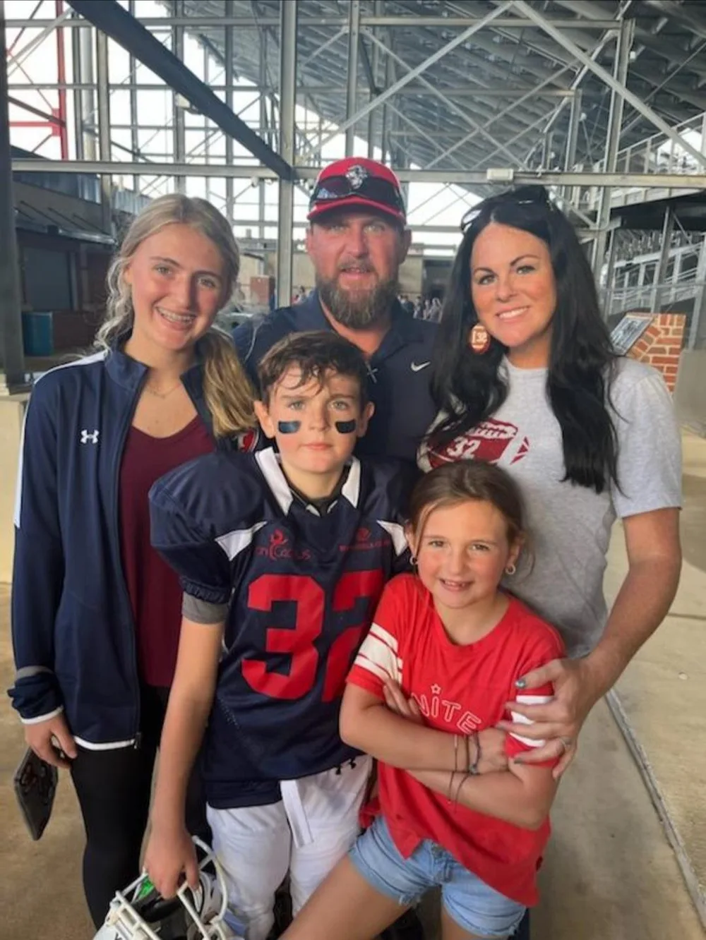 The Crawford family together, with Hayes in his number 32 football jersey